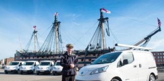 Commodore Jeremy Rigby, Naval Base Commander, is pictured beside the electric vans, e-NV200 Combis